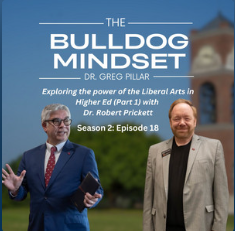 Two men in suits stand outside, one holding a tablet and speaking. Text above them reads: “The Bulldog Mindset Dr. Greg Pillar. Exploring the power of the Liberal Arts in Higher Ed (Part 1) with Dr. Robert Prickett. Season 2: Episode 18.”.